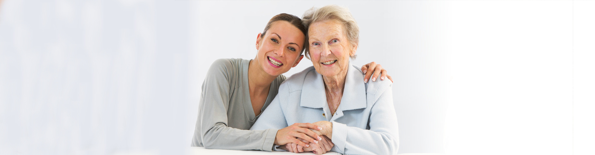 caregiver and elderly smiling